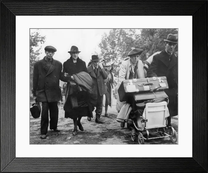 Framed Print : German civilian refugees moved through the streets of Aachen, Germany, in Oct. 1944. They carry possessions to a safe area behind the U.S. first Army lines