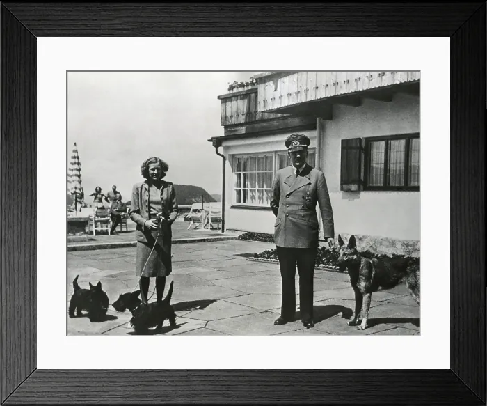 Framed Print : Hitler and Ava Braun with their dogs at Berchtesgaden, ca. 1937-1943. Braun and Hitler remained a couple for 13 years, from 1932-1945. (BSLOC_2015_13_61) Framed Print : Hitler and Ava Braun with their dogs at Berchtesgaden, ca. 1937-1943. Braun and Hitler remained a couple for 13 years, from 1932-1945. (BSLOC_2015_13_61)