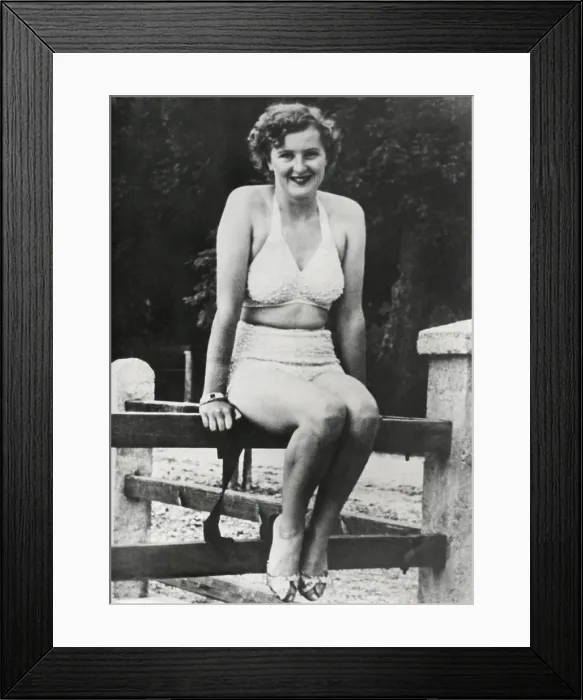 Framed Print : Eva Braun in a two piece bathing suit in the 1930s. Hitler arranged for Braun to work as a photographer for Heinrich Hoffmann, his personal photographer from 1933 Framed Print : Eva Braun in a two piece bathing suit in the 1930s. Hitler arranged for Braun to work as a photographer for Heinrich Hoffmann, his personal photographer from 1933