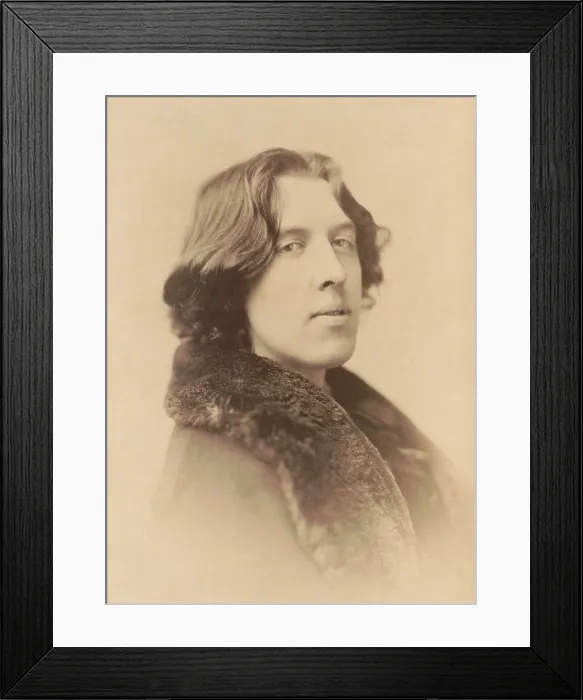 Framed Print : Oscar Wilde, Anglo-Irish playwright and poet in studio portrait by Napoleon Sarony, 1882. Head-and-shoulders portrait, wearing coat with fur collar (BSLOC_2016_11_182) Framed Print : Oscar Wilde, Anglo-Irish playwright and poet in studio portrait by Napoleon Sarony, 1882. Head-and-shoulders portrait, wearing coat with fur collar (BSLOC_2016_11_182)
