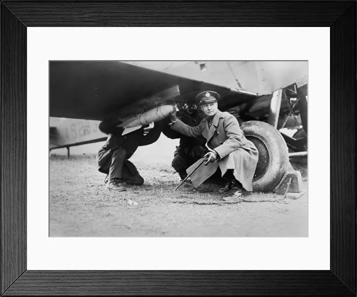 Framed Print : Brigadier General Billy Mitchell and another man, attaching a bomb under wing of airplane. Ca. 1925 Framed Print : Brigadier General Billy Mitchell and another man, attaching a bomb under wing of airplane. Ca. 1925