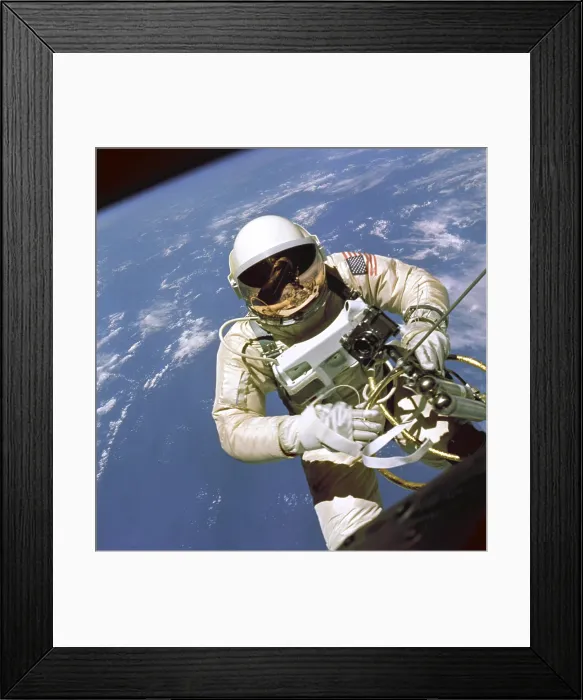 Framed Print : Astronaut Edward White floats in space. The Gemini 4 pilot was attached to the spacecraft by a 25-ft. umbilical line that provided oxygen. June 3, 1965