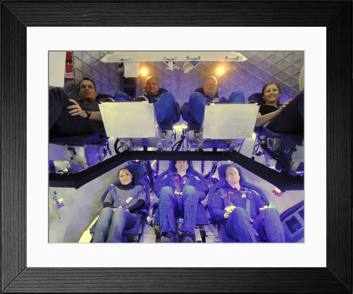 Framed Print : NASA astronauts and industry experts check out the crew accommodations in the Dragon spacecraft under development by Space Exploration Technologies, SpaceX