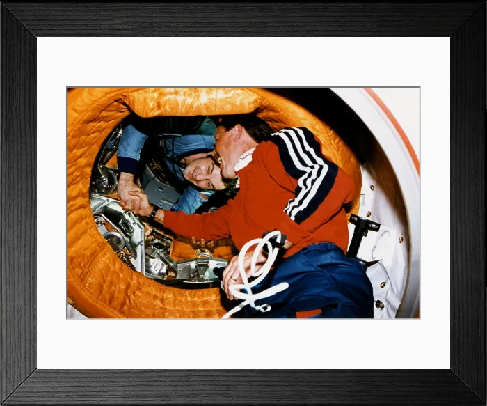 Framed Print : Astronaut Robert Gibson, greets Cosmonaut Vladimir Dezhurov in space. The Space Shuttle docked at the Russian Mir Space Station on June 29, 1995