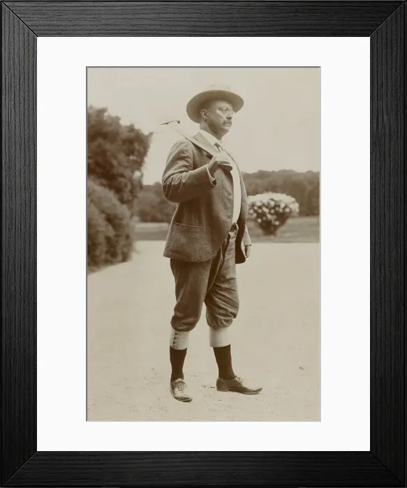 Framed Print : Theodore Roosevelt as a woodchopper, wearing knickerbockers and carrying an axe. 1901 photo by James Burton, at his Long Island home, Sagamore Hill (BSLOC_2017_4_47)