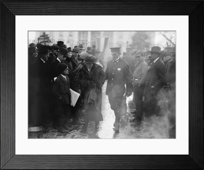 Framed Print : Policeman leads an arrested National Woman's Party protestor away from a woman's suffrage bonfire demonstration at the White House in 1918