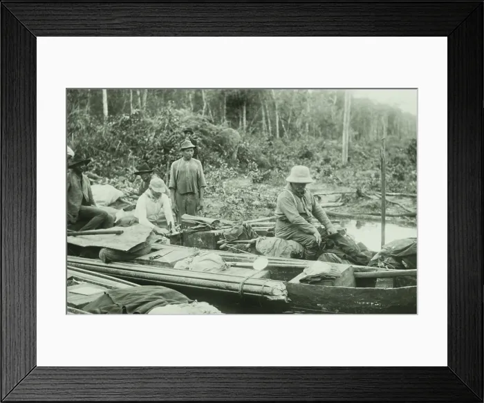 Framed Print : Theodore Roosevelt (right) in a heavily loaded dugout canoe, Feb. 27, 1914