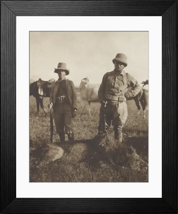 Framed Print : Theodore Roosevelt and local scout Leslie Tarleton stand over a dead lion shot by TR