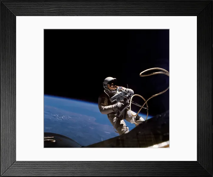 Framed Print : Astronaut Edward White floating weightless during the first US spacewalk. June 3, 1965 Framed Print : Astronaut Edward White floating weightless during the first US spacewalk. June 3, 1965
