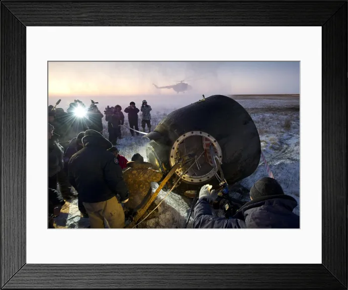 Framed Print : Soyuz TMA-02M spacecraft is opened by Russian land crew in Kazakhstan. The capsule returned International Space Station Expedition 29 after five months in space. Nov. 21, 2011