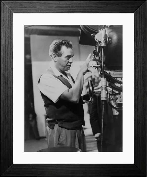 Framed Print : Desi Arnaz at a camera as executive producer of I LOVE LUCY TV series from 1952-57. Desilu Productions filmed the live performances with multiple sets and camera