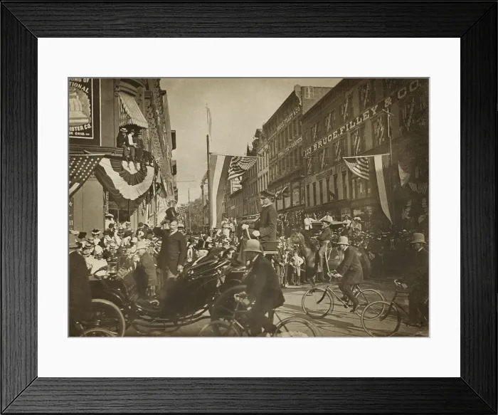 Framed Print : Theodore Roosevelt standing in a carriage, tipping his hat, escorted by bicycle police in 1902. Unidentified location (BSLOC_2017_4_54) Framed Print : Theodore Roosevelt standing in a carriage, tipping his hat, escorted by bicycle police in 1902. Unidentified location (BSLOC_2017_4_54)