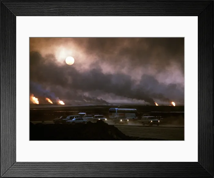 Framed Print : The smoke from oil well fires forces Kuwait drivers to use their headlights during daylight. Retreating Iraqi troops set fire to Kuwait's oil fields. April 22 1991 Framed Print : The smoke from oil well fires forces Kuwait drivers to use their headlights during daylight. Retreating Iraqi troops set fire to Kuwait's oil fields. April 22 1991