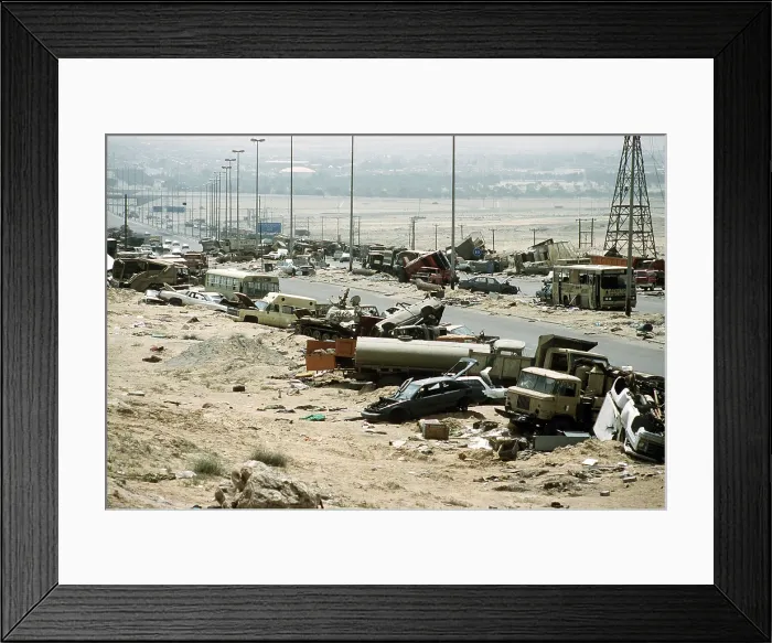 Framed Print : Demolished vehicles line Highway 80 the Highway of Death were destroyed as Iraqi forces retreated from Kuwait during Operation Desert Storm