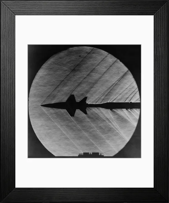 Framed Print : Supersonic Shocks waves attached to a small scale model of the X-15 experiment rocket plane. Mar. 23, 1962 Framed Print : Supersonic Shocks waves attached to a small scale model of the X-15 experiment rocket plane. Mar. 23, 1962