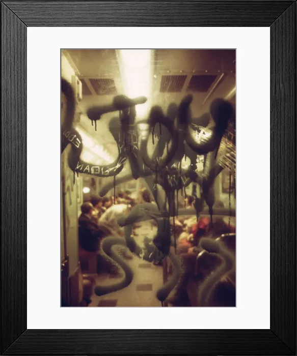 Framed Print : New York City Subway. View through a graffiti fogged window into a New York City subway car. May 1973