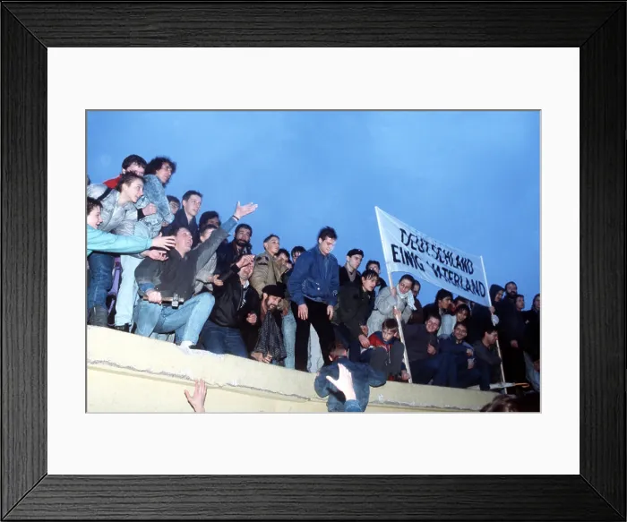 Framed Print : A crowd celebrates atop the Berlin Wall following the official opening of the Brandenburg Gate on Dec. 22 1989. (BSLOC_2011_3_50) Framed Print : A crowd celebrates atop the Berlin Wall following the official opening of the Brandenburg Gate on Dec. 22 1989. (BSLOC_2011_3_50)