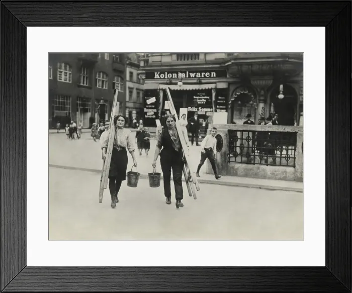 Framed Print : German women window cleaners dressed for work carry their tools in a Berlin street in World War 1. 1914-1918 (BSLOC_2017_2_49)