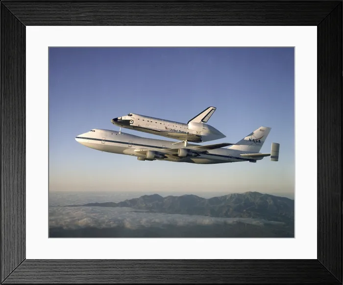 Framed Print : Space shuttle Atlantis atop the a customized 747 flies piggy back to the Kennedy Space Center after a ten month refurbishment. Sept. 1, 1998 Framed Print : Space shuttle Atlantis atop the a customized 747 flies piggy back to the Kennedy Space Center after a ten month refurbishment. Sept. 1, 1998