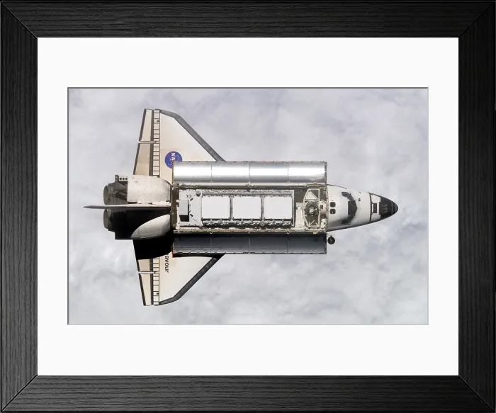 Framed Print : Space shuttle Endeavour approaching the International Space Station. Within the cargo bay are modules for expanding the space station. Nov. 25, 2002