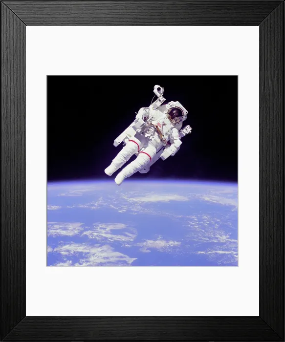 Framed Print : Astronaut Bruce McCandless in floating weightless 320 feet from the space shuttle Challenger. He tested a nitrogen jet propelled backpack to maneuver in zero gravity. Feb Framed Print : Astronaut Bruce McCandless in floating weightless 320 feet from the space shuttle Challenger. He tested a nitrogen jet propelled backpack to maneuver in zero gravity. Feb