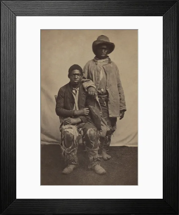 Framed Print : Two unidentified escaped male slaves wearing ragged clothes in Louisiana during the Civil War, C. 1861-65. Photo by McPherson & Oliver, Baton Rouge (BSLOC_2018_5_90)
