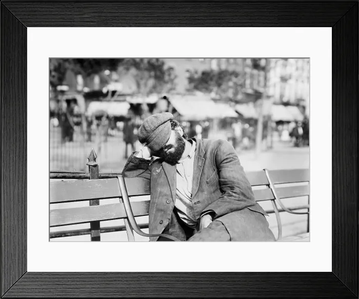 Framed Print : Man sleeping with his hat over eyes, on a park bench on the Lower East Side of Manhattan, Sept. 12, 1912