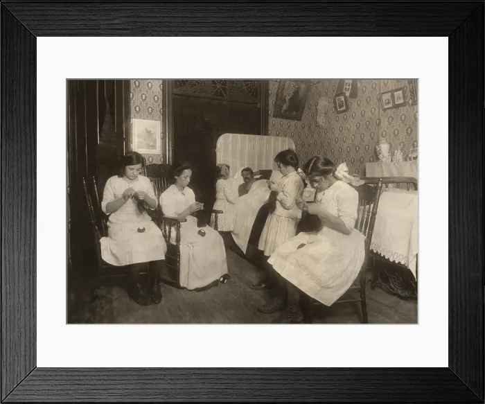 Framed Print : Italian-American family doing homework in their apartment, with the father sick in bed. The mother, two teenagers, and one girl are crocheting bags in NYC, in Nov. 1912 Framed Print : Italian-American family doing homework in their apartment, with the father sick in bed. The mother, two teenagers, and one girl are crocheting bags in NYC, in Nov. 1912