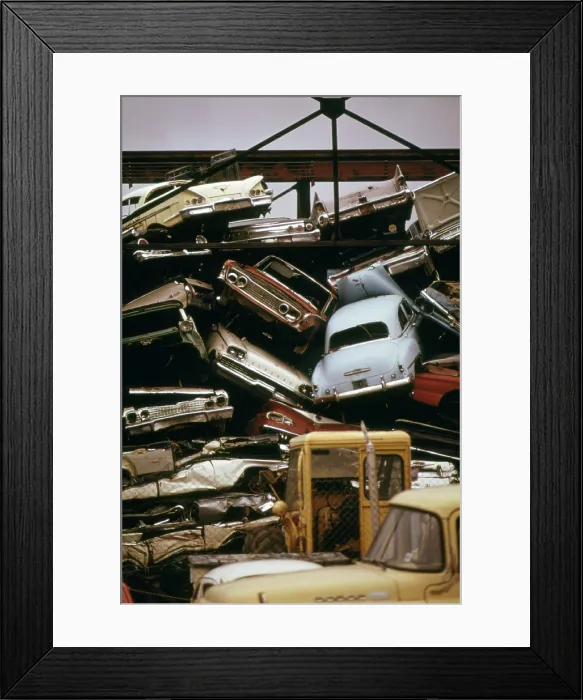 Framed Print : American cars crushed for scrap steel to be recycled used in the manufacture of steel. Ca. 1973-75 Framed Print : American cars crushed for scrap steel to be recycled used in the manufacture of steel. Ca. 1973-75