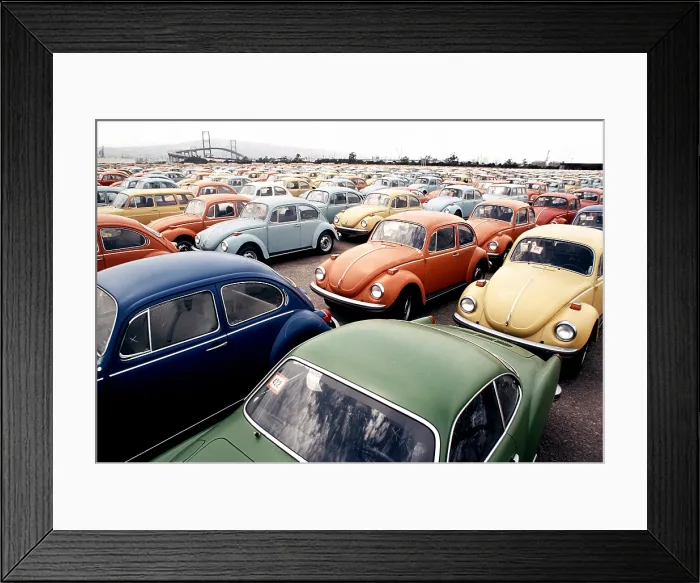 Framed Print : Imported Volkswagen Beetles on an American pier. These German cars Japanese cars were among the millions imported to compete with the large gas guzzling American cars. Ca.1973-75