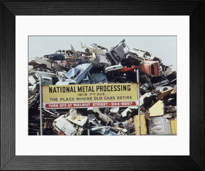 Framed Print : An automobile junkyards shreds and compacts cars to recycle the scrap steel. Philadelphia area ca. 1973-75 Framed Print : An automobile junkyards shreds and compacts cars to recycle the scrap steel. Philadelphia area ca. 1973-75