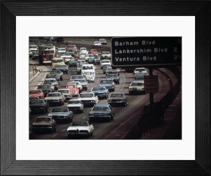 Framed Print : Four lanes of traffic on the Hollywood Freeway near Ventura beach in Los Angeles. Ca. 1973-75