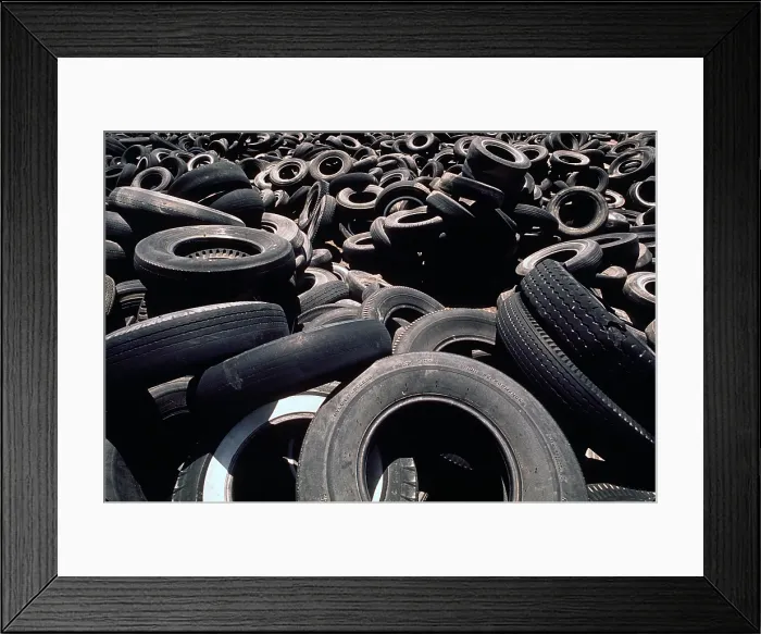 Framed Print : Dump of discarded automobile tires that are to be burned creating a pollution smoke hazard. Ca. 1973-75