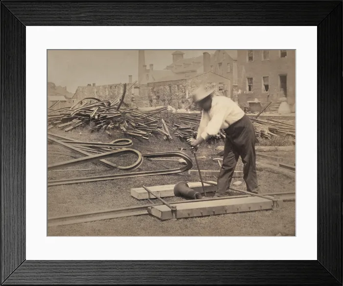 Framed Print : An African American railroad construction worker straightens track for the Union during the Civil War, 1862-63. Both sides twisted rails, as seen in the in background Framed Print : An African American railroad construction worker straightens track for the Union during the Civil War, 1862-63. Both sides twisted rails, as seen in the in background