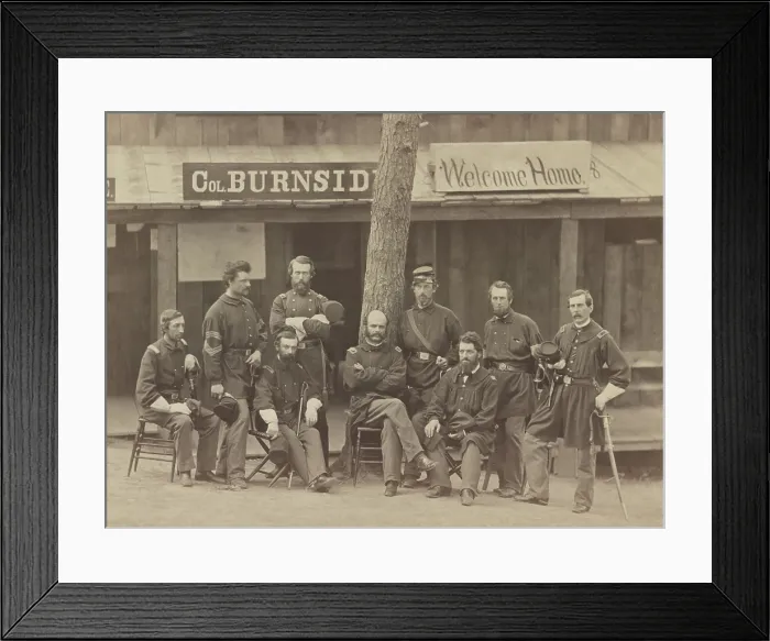 Framed Print : Major General Ambrose Burnside (seated, center) and officers of the 1st Rhode Island Volunteers at Camp Sprague, Rhode Island, 1861. Behind them is a sign reading, Col