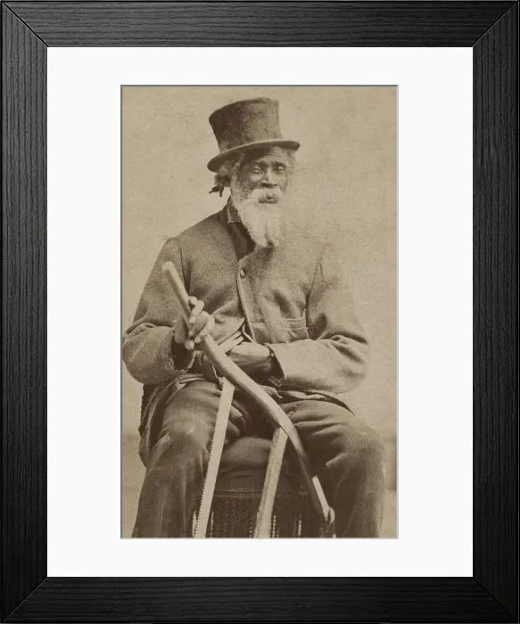 Framed Print : Elderly African American man poses with a top hat, coat, and with a bow saw, c. 1855-1870. The bow saw suggests he was a valuable and skilled carpenter
