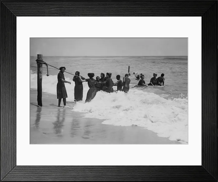Framed Print : African Americans enjoying the beach at Asbury Park, New Jersey, in July 1908. The women are dressed in bathing dresses and stockings as they play in the surf (BSLOC_2017_20_122) Framed Print : African Americans enjoying the beach at Asbury Park, New Jersey, in July 1908. The women are dressed in bathing dresses and stockings as they play in the surf (BSLOC_2017_20_122)