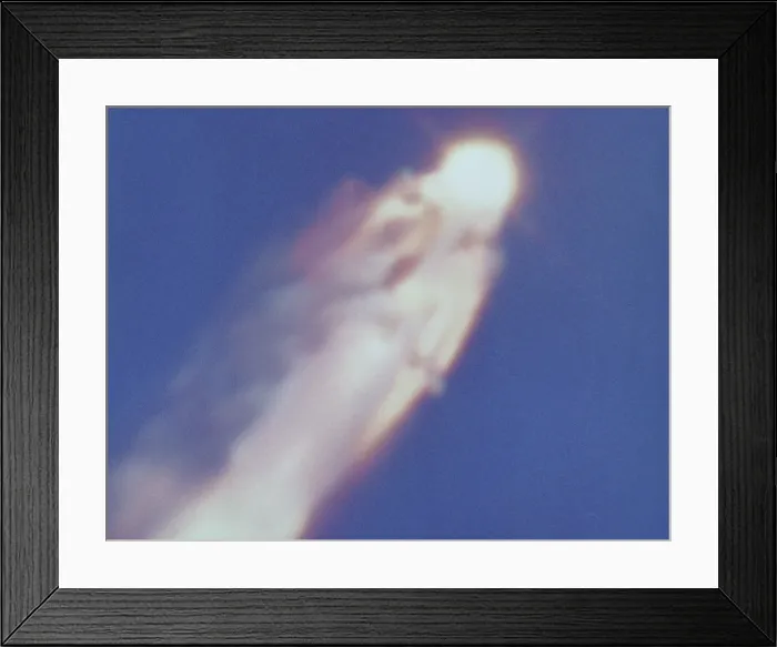 Framed Print : Space shuttle Challenger disaster. Challenger is completely engulfed in a fiery flow of escaping liquid propellant. Jan. 28, 1986 Framed Print : Space shuttle Challenger disaster. Challenger is completely engulfed in a fiery flow of escaping liquid propellant. Jan. 28, 1986