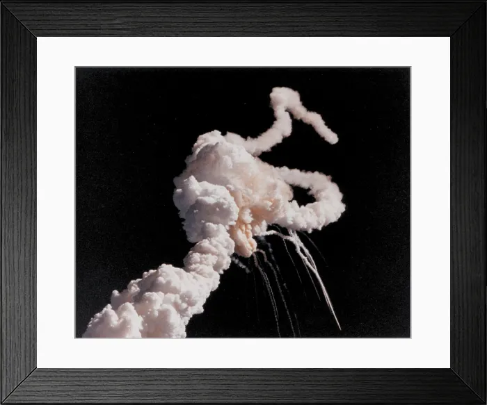 Framed Print : Space shuttle Challenger disaster. Space shuttle exhaust plumes entwined around a ball of gas after a few seconds after the explosion caused by ruptured O-rings. Jan. 28, 1986