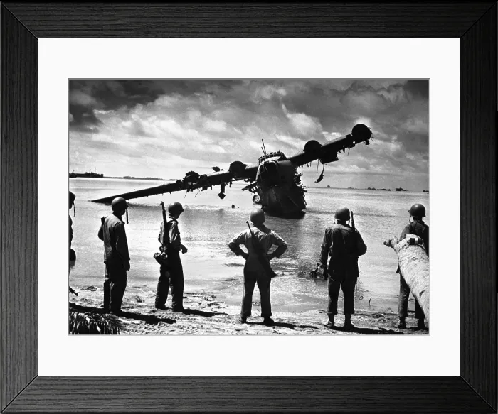Framed Print : U.S. Army troops look at the ruins of a Japanese seaplane in the lagoon near Makin Island, Tarawa Atoll. The Japanese used it as a machine gun nest. Nov. 19-23, 1943