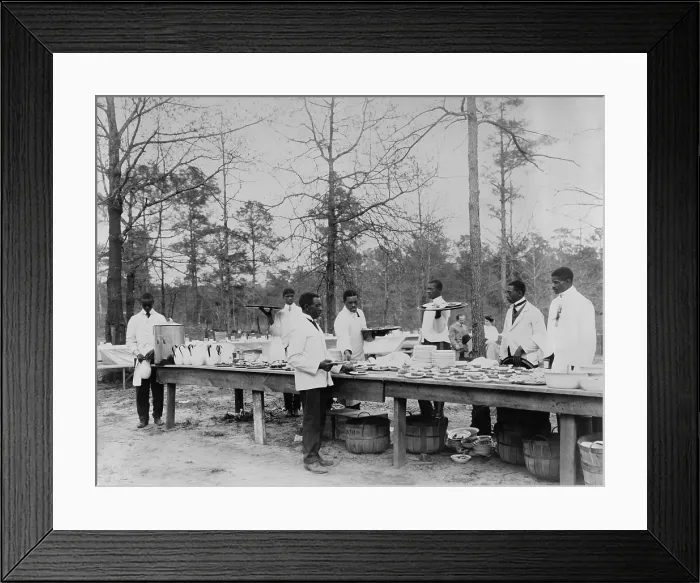 Framed Print : African American students serving a meal in an outdoor setting at Tuskegee Institute, c. 1890-1910