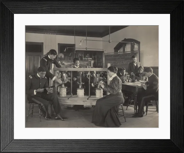 Framed Print : Students learning to operate a cheese press screw in agricultural sciences class, c. 1899-1900