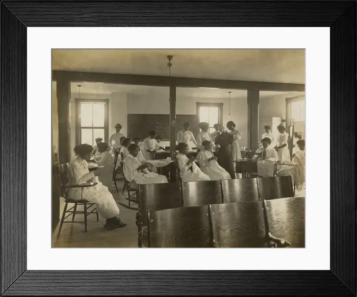 Framed Print : African-American women sewing by hand and with sewing machine in classroom, c. 1911-18