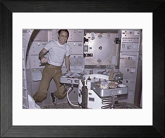 Framed Print : Skylab 4 Astronaut Ed Gibson preparing his meal aboard the Skylab space station. Skylab 4 mission lasted 84 days, testing the effects of prolonged zero gravity. Nov