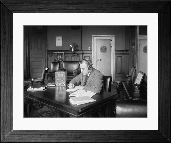 Framed Print : Postmaster General Hubert Work listening to a radio in his office, March 9, 1922