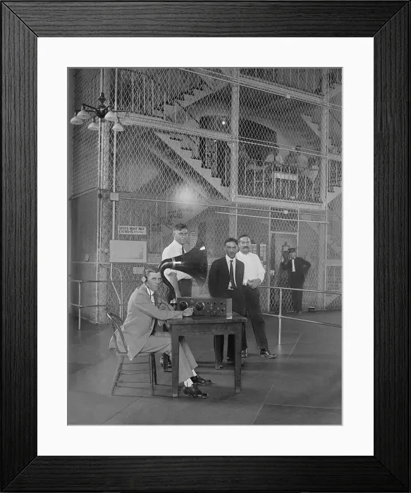 Framed Print : Prisoners in a Washington D.C. vicinity jail listen to a radio broadcast in 1922. A horn speaker projects the sound (BSLOC_2016_10_56)