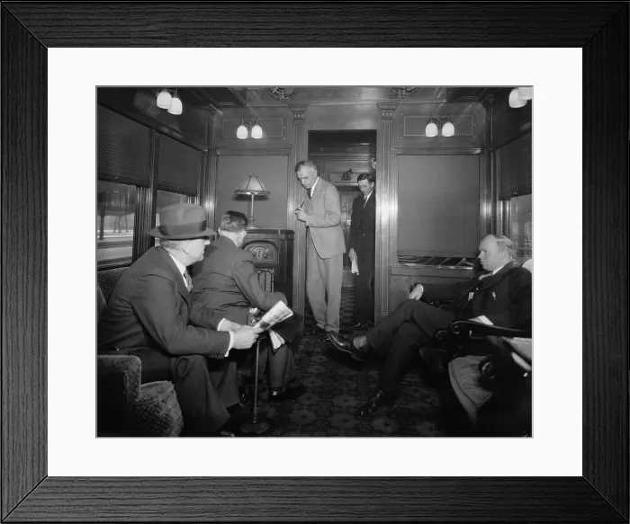 Framed Print : Group of men listening to a radio in a railroad lounge car, in Washington, D.C. vicinity. The radio features a speaker enclosed within the cabinet (BSLOC_2016_10_58)