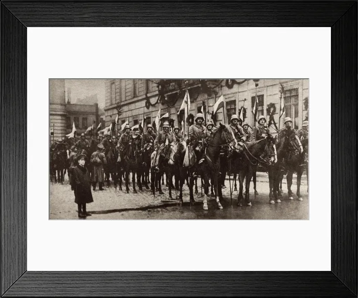 Framed Print : German soldiers welcomed home from the World War 1. 1918. Squadron of Prussian cavalry with decorated flagstaffs standing before Berlin building festooned with wreaths