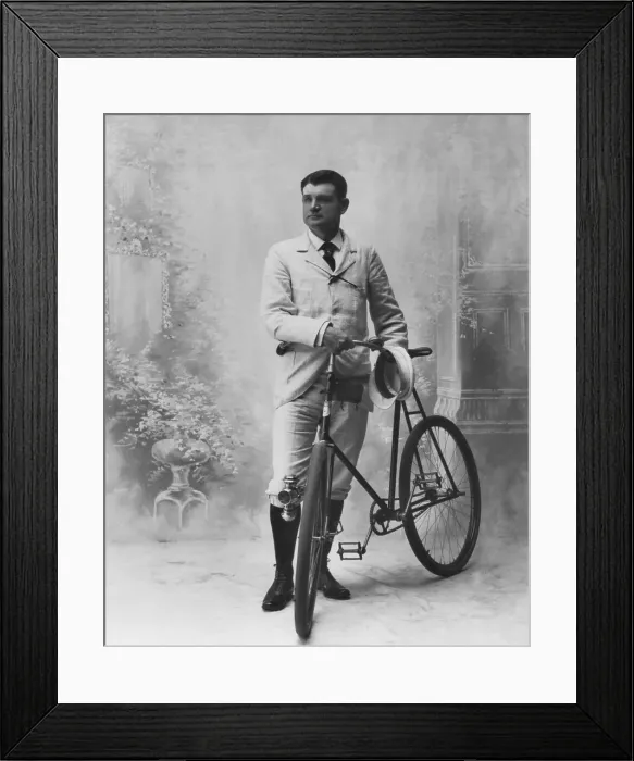 Framed Print : Studio portrait of young man and his bicycle, c. 1895