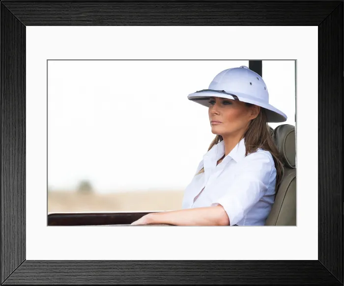Framed Print : First Lady Melania Trump wearing a pith helmet on a safari tour on Oct. 5, 2018, at the Nairobi National Park in Nairobi, Kenya. (BSLOC_2018_8_195) Framed Print : First Lady Melania Trump wearing a pith helmet on a safari tour on Oct. 5, 2018, at the Nairobi National Park in Nairobi, Kenya. (BSLOC_2018_8_195)